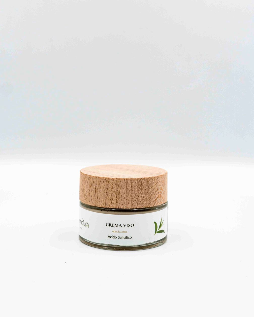 Vasetto in vetro contenente crema viso purificante all'acido salicilico con il tappo chiuso.